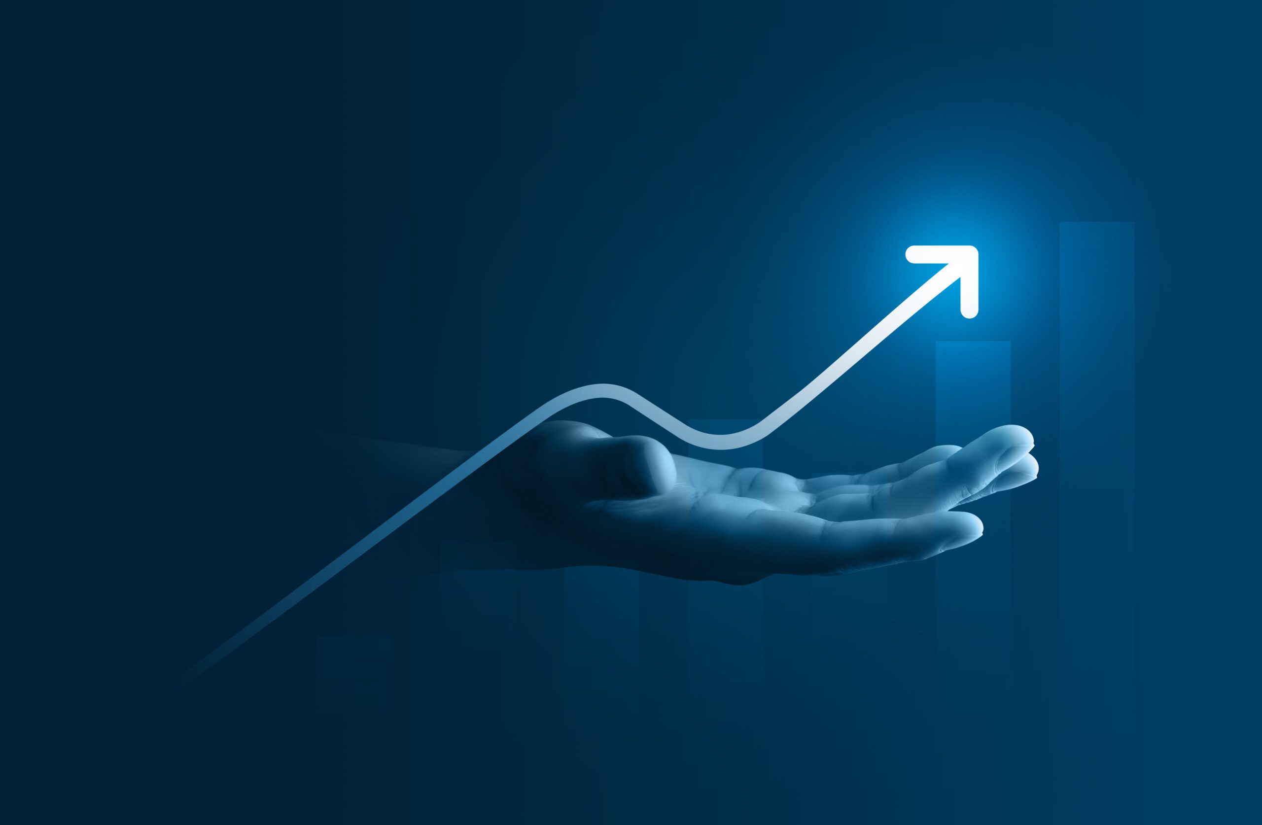 An upward trending arrow hovers above an open hand against a dark blue background, symbolizing growth and success. The image conveys a futuristic, digital theme with a glowing effect on the arrow.